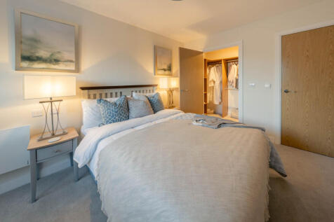 Master bedroom of apartment 47, including a walk in wardrobe